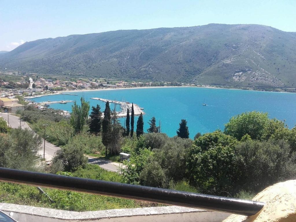 a view of a large blue lake with a mountain at Amazing view apartment in Plataria