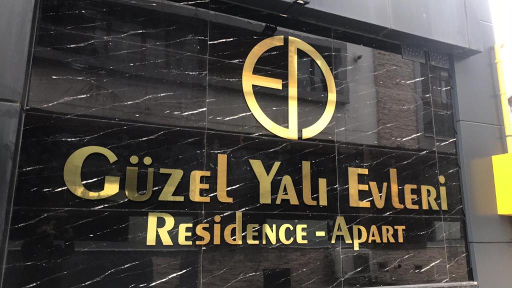 a sign for the guelph valli expert reference agent at Güzel Yalı Evleri Residence &Apart Hotel in Atakum