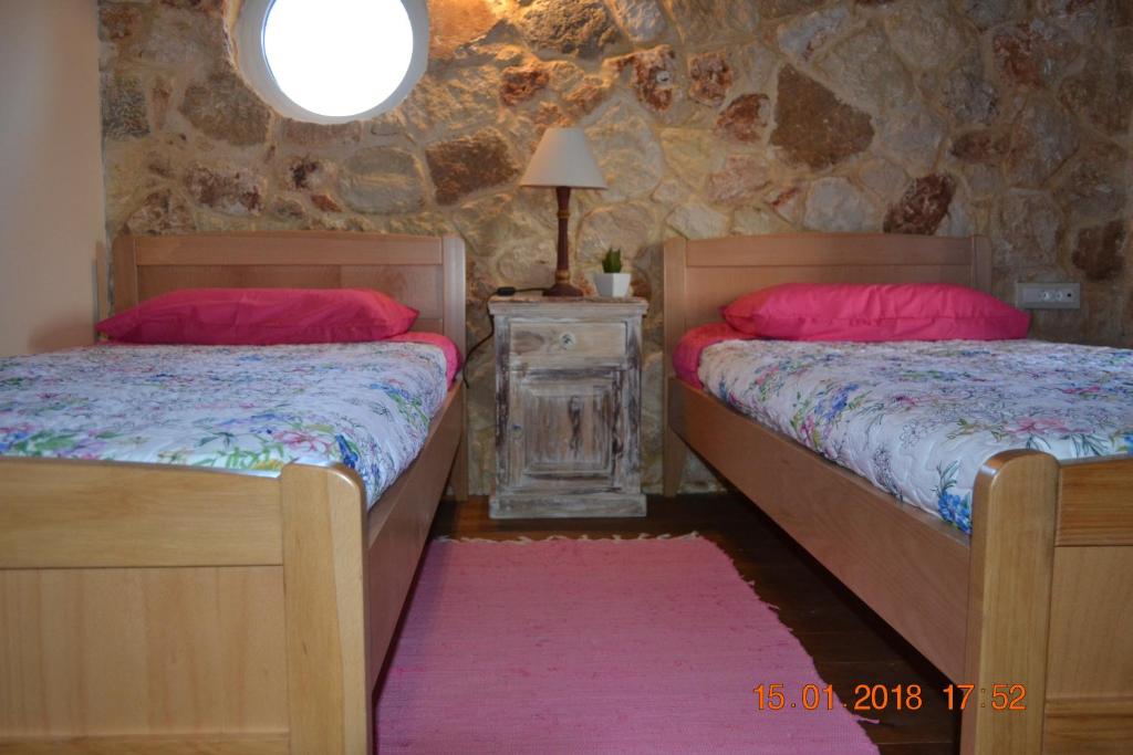 Postel nebo postele na pokoji v ubytování Rumpis Traditional House