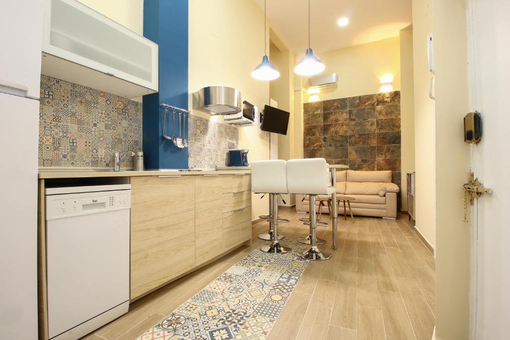 Una cocina o zona de cocina en Deluxe Apartment in La Giralda