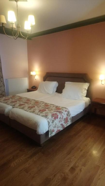 Postel nebo postele na pokoji v ubytování Hotel Pelasgos