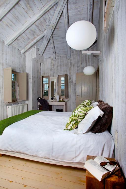 Postel nebo postele na pokoji v ubytování Mikro Papigo 1700 Hotel & Spa