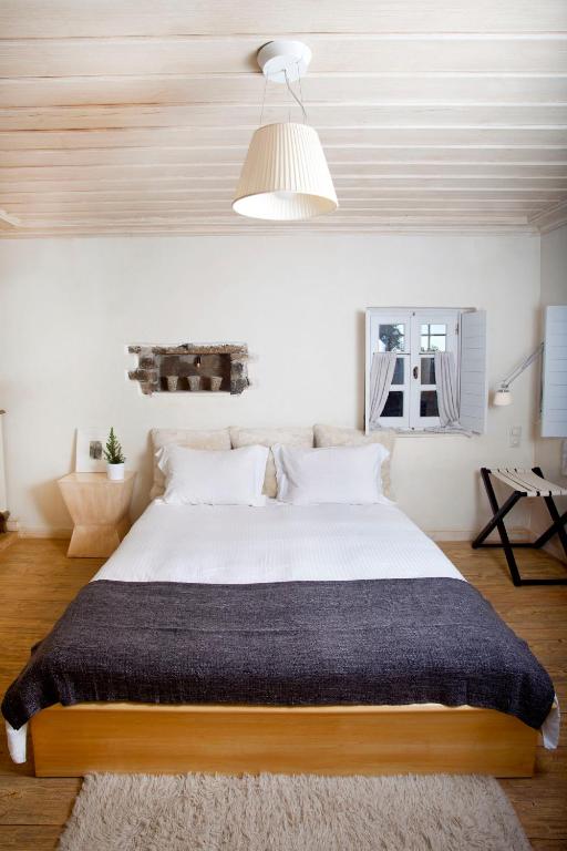 Postel nebo postele na pokoji v ubytování Mikro Papigo 1700 Hotel & Spa