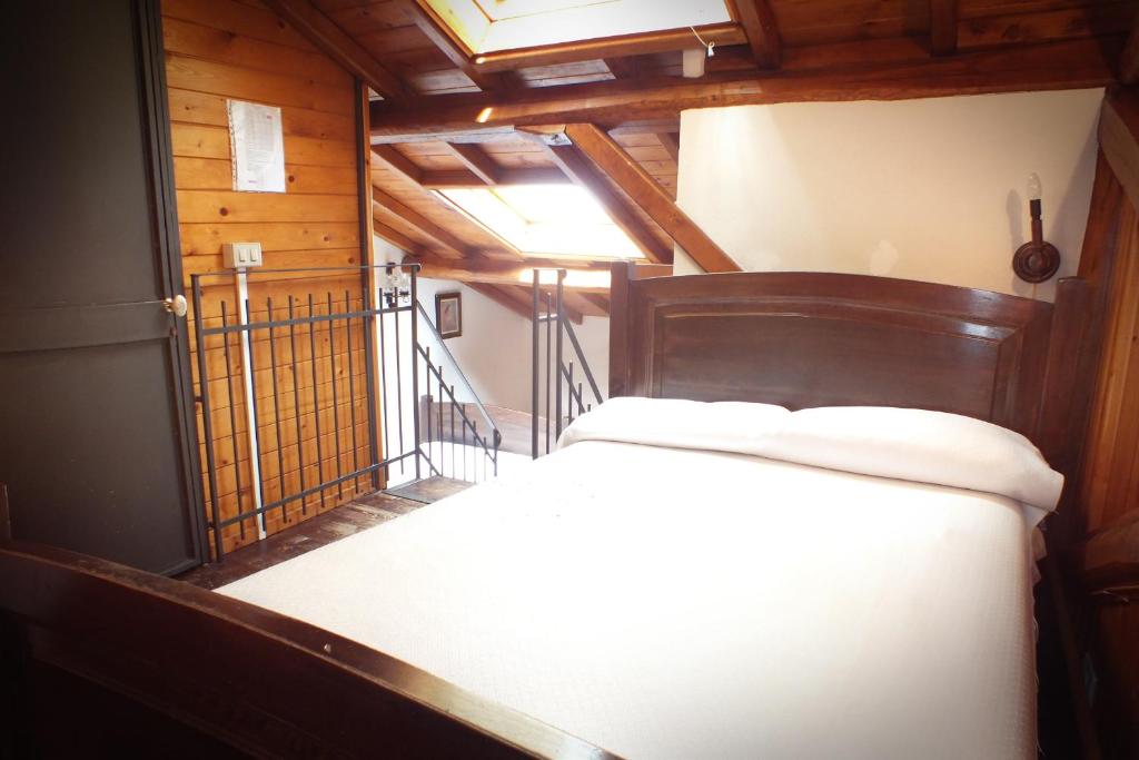 Łóżko lub łóżka w pokoju w obiekcie Agriturismo Kikajon