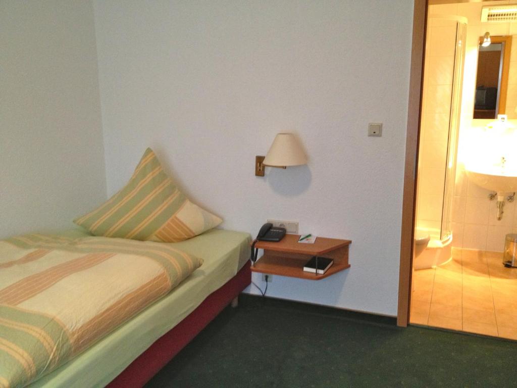 Postel nebo postele na pokoji v ubytování Die Hardtmühle