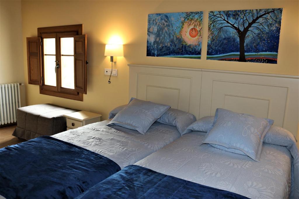 Postel nebo postele na pokoji v ubytování Villa Fontanas