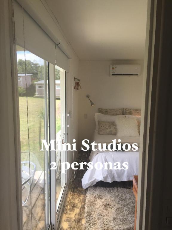 Postel nebo postele na pokoji v ubytování Hjem Studios