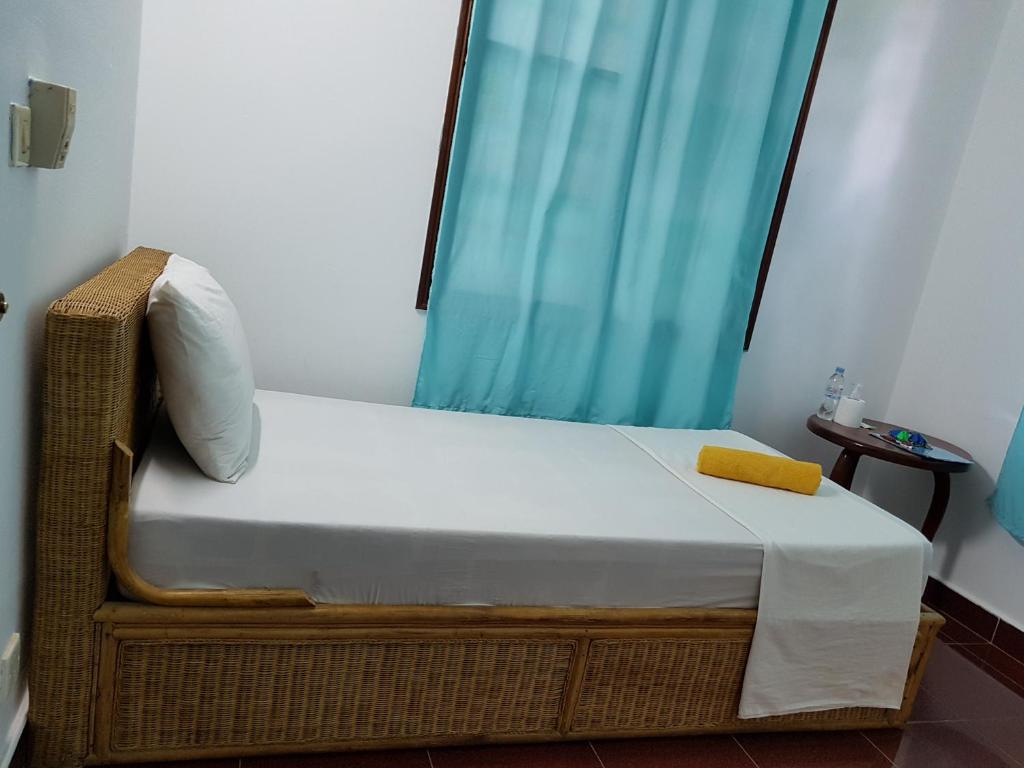 Postel nebo postele na pokoji v ubytování Smiley's Guesthouse