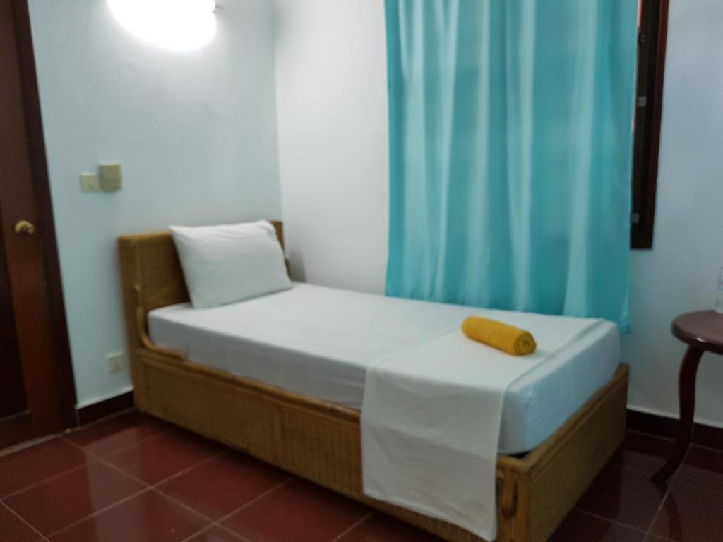 Postel nebo postele na pokoji v ubytování Smiley's Guesthouse