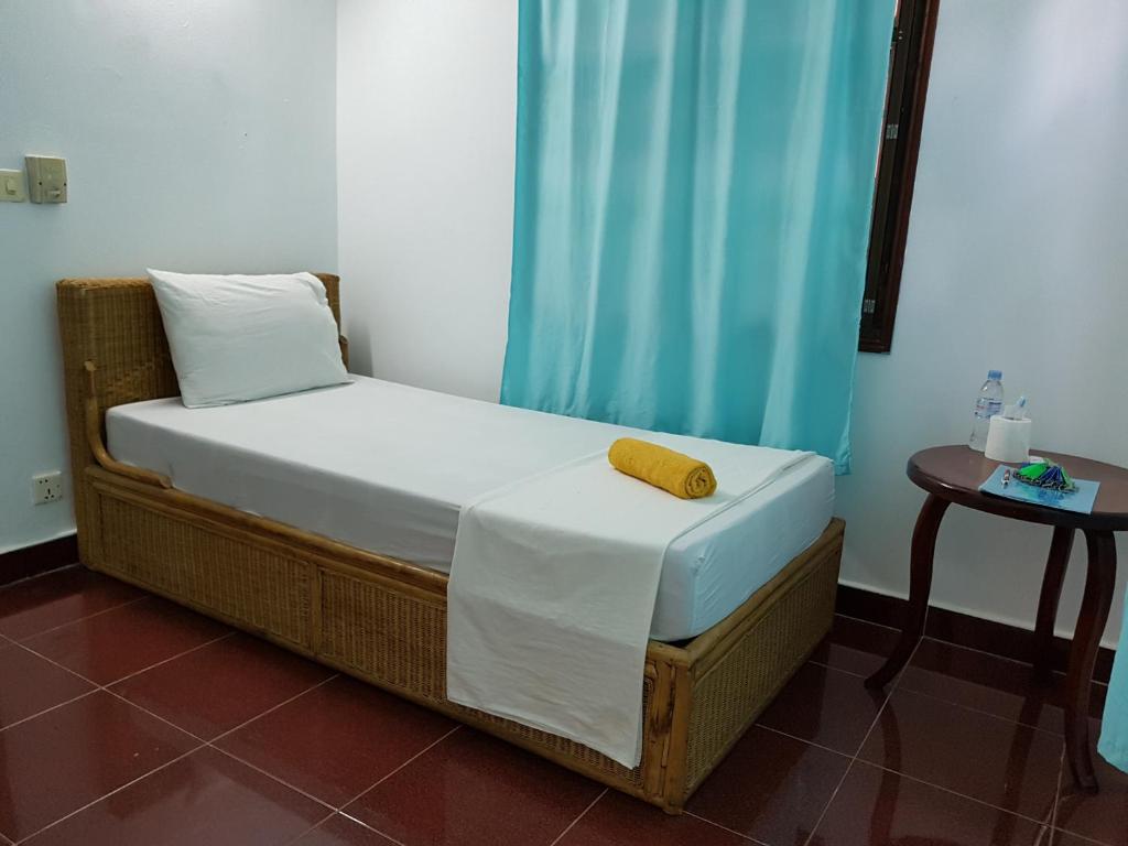 Postel nebo postele na pokoji v ubytování Smiley's Guesthouse