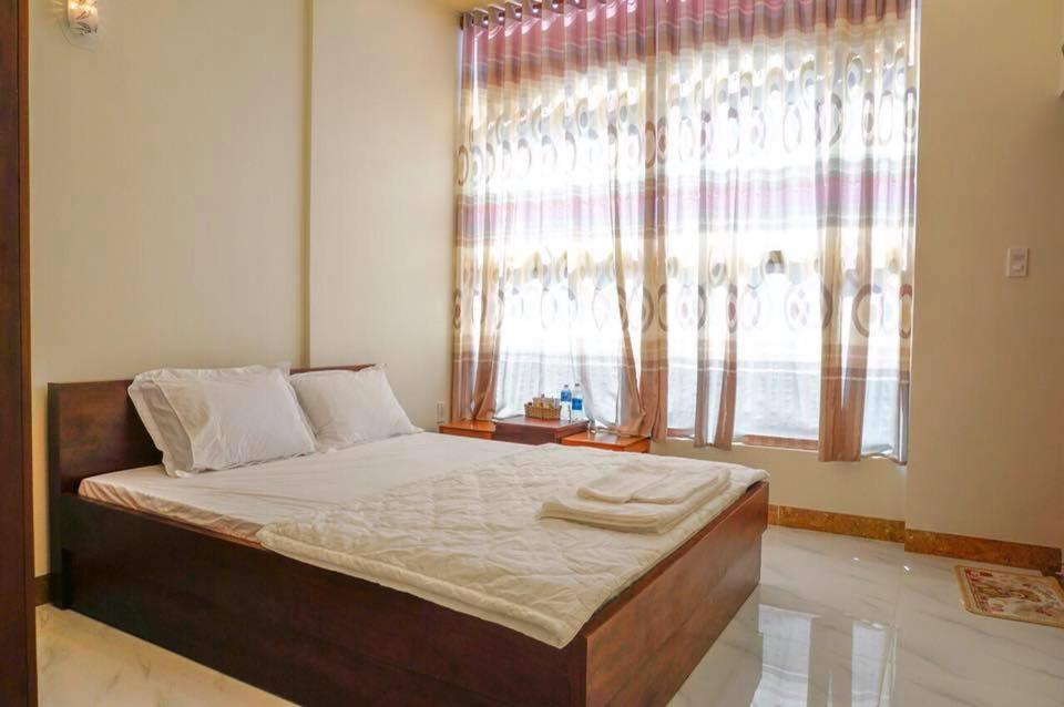 Giường trong phòng chung tại Hotel Tan Phu