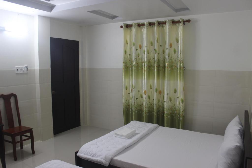 Postel nebo postele na pokoji v ubytování HaiVan HosTel