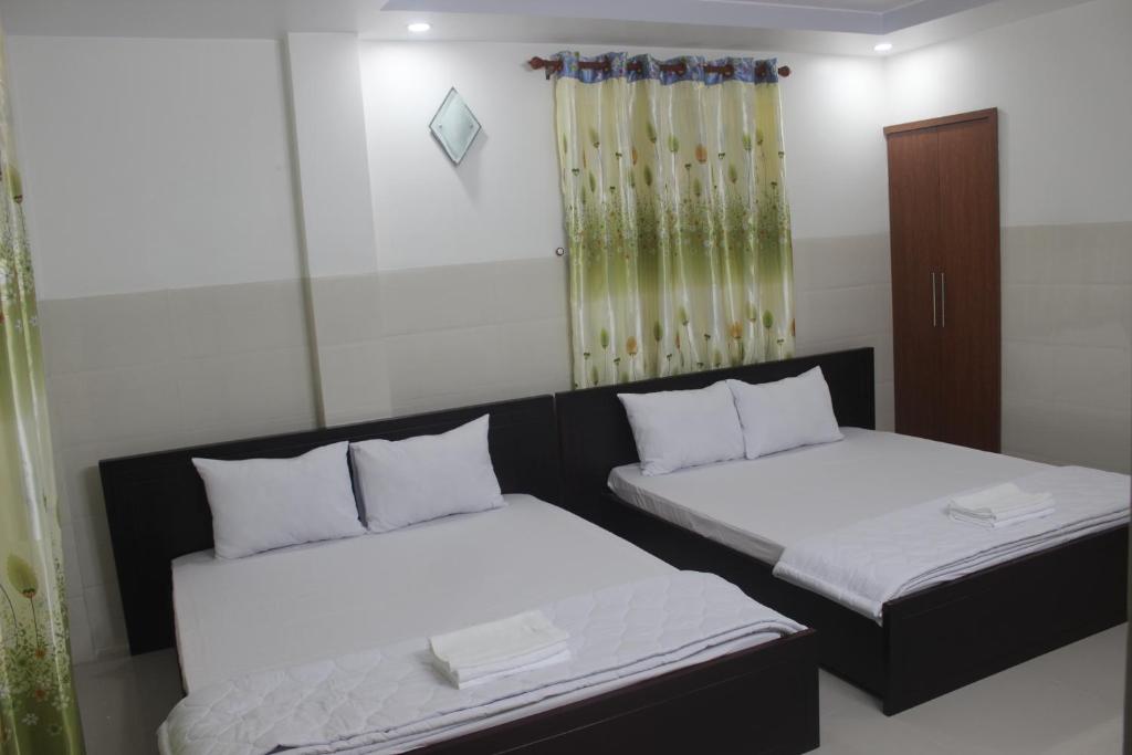 Postel nebo postele na pokoji v ubytování HaiVan HosTel