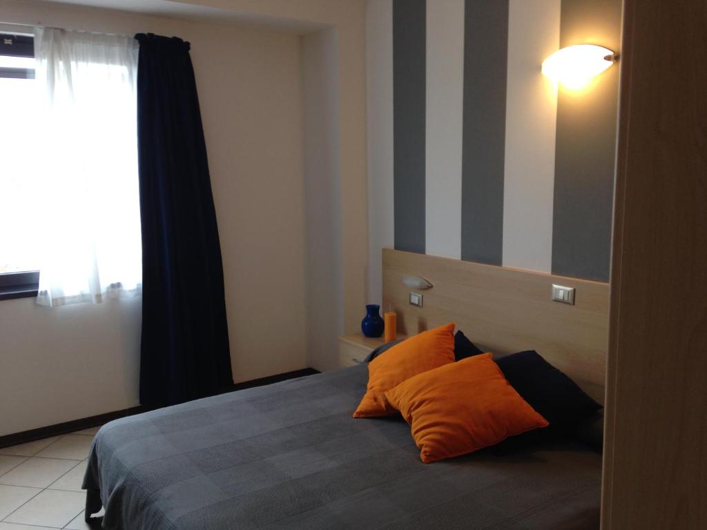 Postel nebo postele na pokoji v ubytování Hotel Bussana