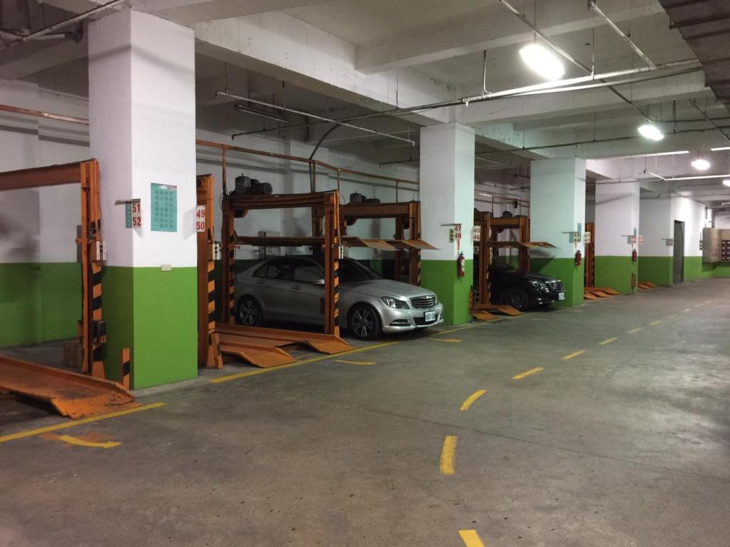 a parking garage with a car parked in it at Dynasty Hotel in Tainan