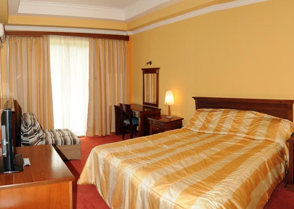 Postel nebo postele na pokoji v ubytování Hotel Granit