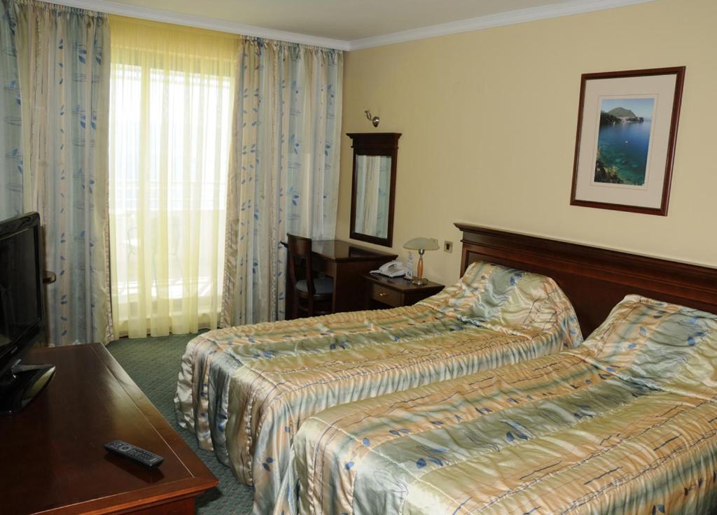 Postel nebo postele na pokoji v ubytování Hotel Granit