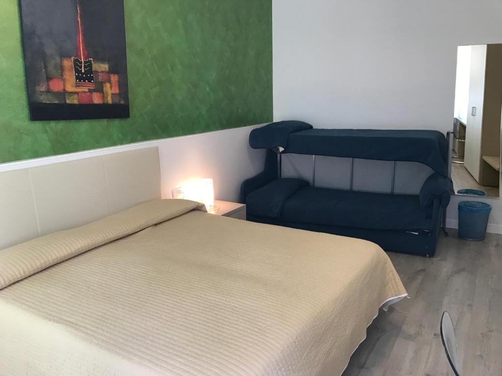 Postel nebo postele na pokoji v ubytování Hotel Alpino