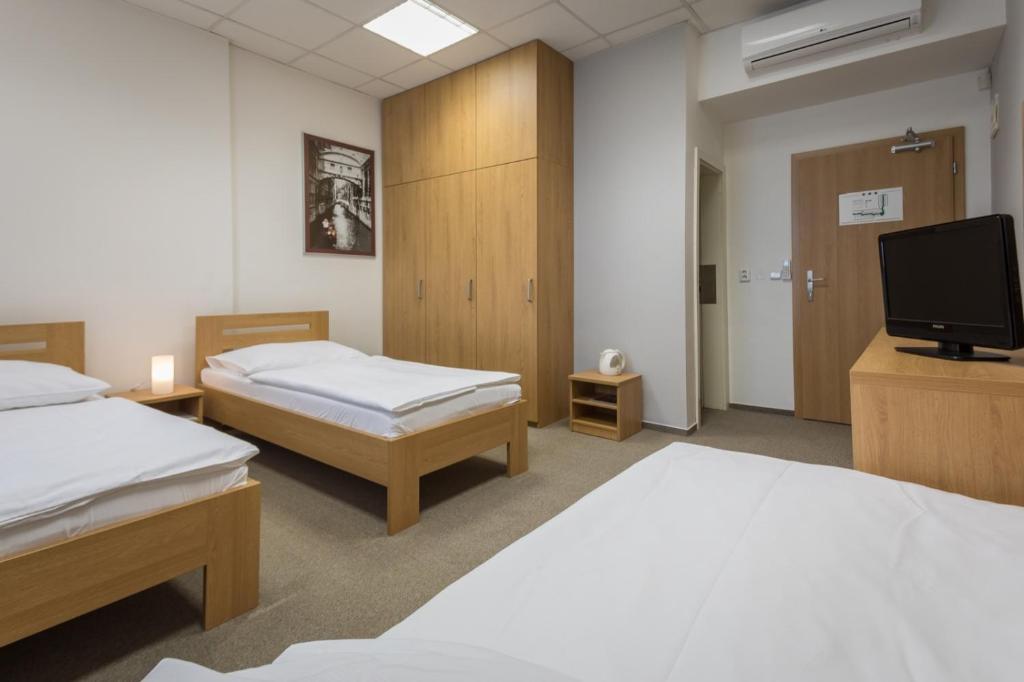 Postel nebo postele na pokoji v ubytování Sareza hotel
