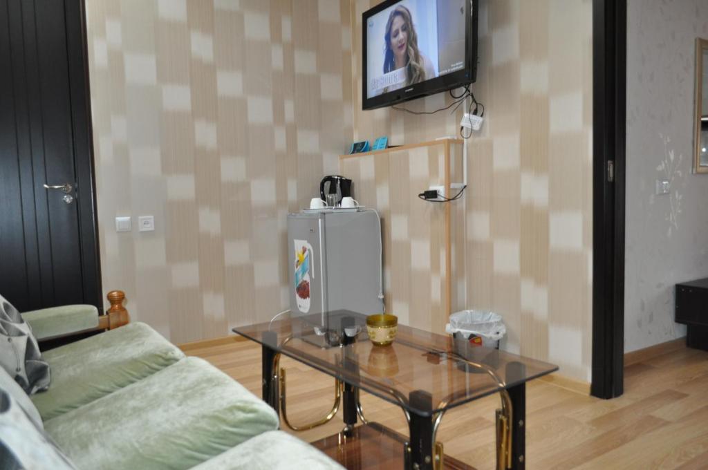 TV a/nebo společenská místnost v ubytování Hotel Your Comfort