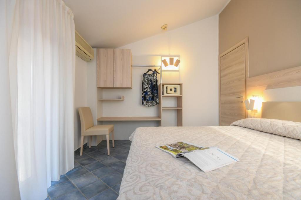 Postel nebo postele na pokoji v ubytování Hotel Riel