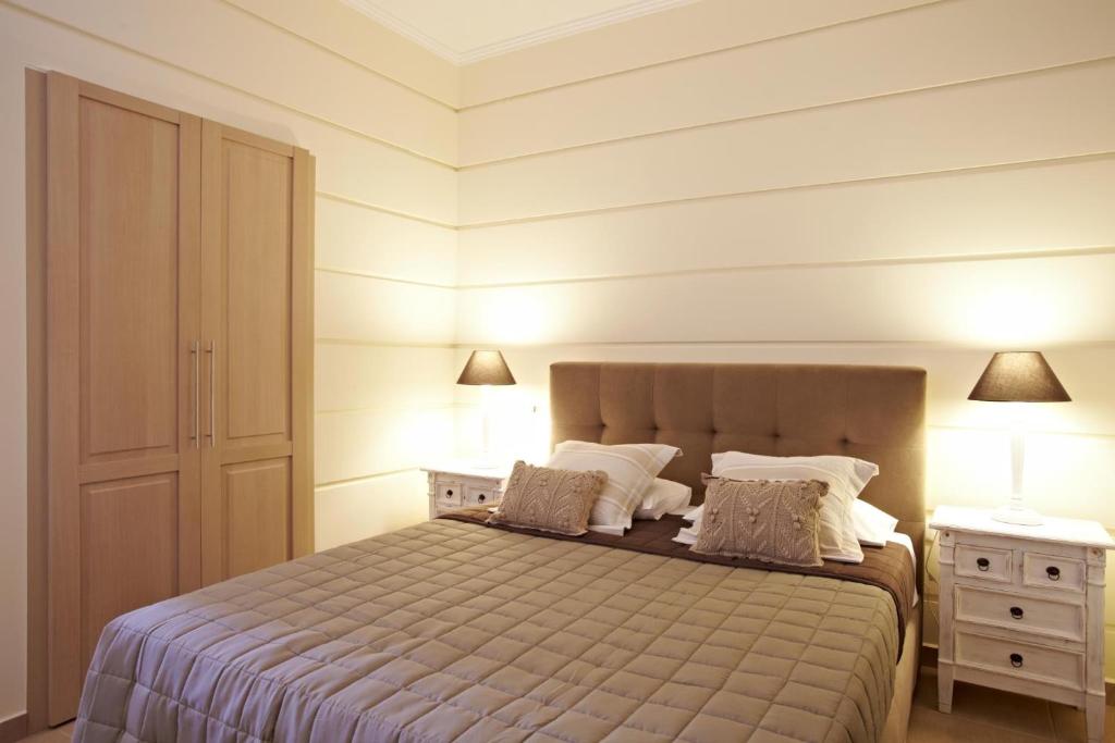 Кровать или кровати в номере Elaion mini suites