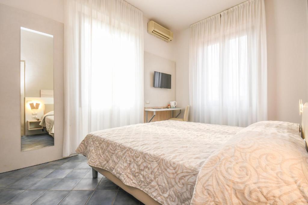 Postel nebo postele na pokoji v ubytování Hotel Riel
