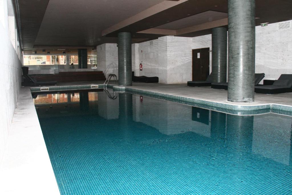 a large swimming pool with a pool at Apartamento T&T Ocean - Foz Palace Residence Spa in Portimão