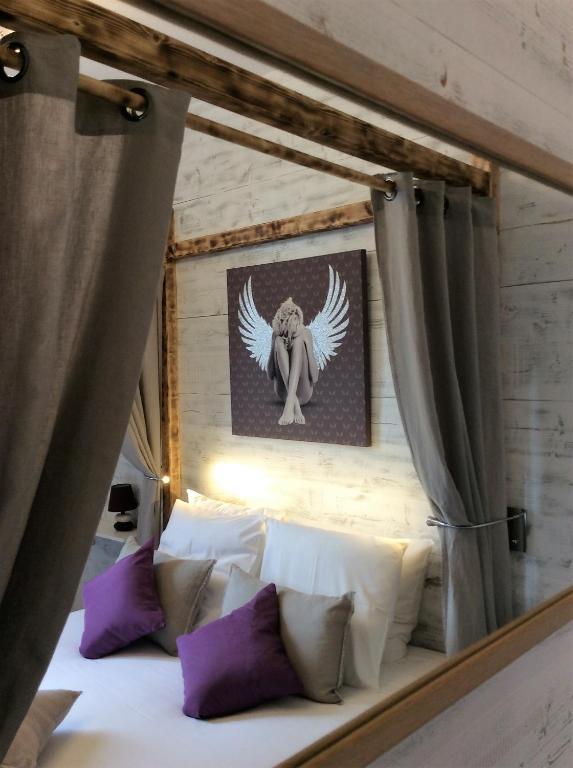 Postel nebo postele na pokoji v ubytování Hôtel Familial L'Ostréi