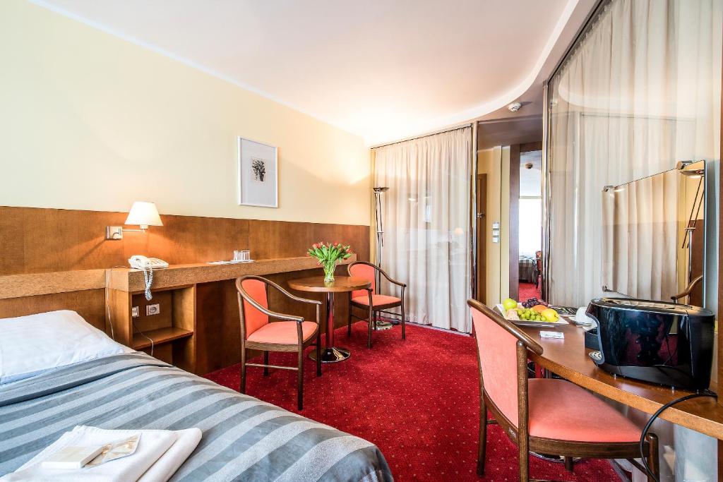 Postel nebo postele na pokoji v ubytování Hotel Jana