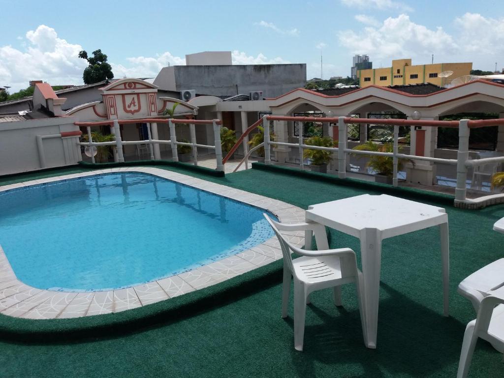 a large swimming pool on the roof of a building at Atalanta Hotel in Macapá