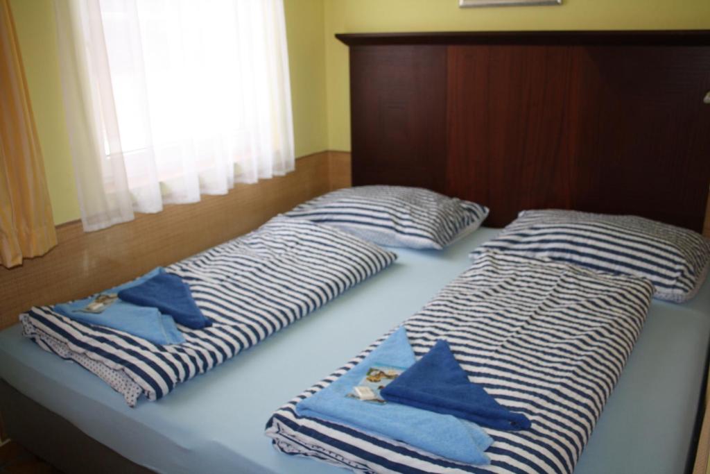 Postel nebo postele na pokoji v ubytování Penzion Kaminek