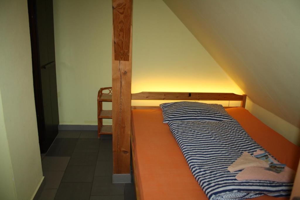Postel nebo postele na pokoji v ubytování Penzion Kaminek