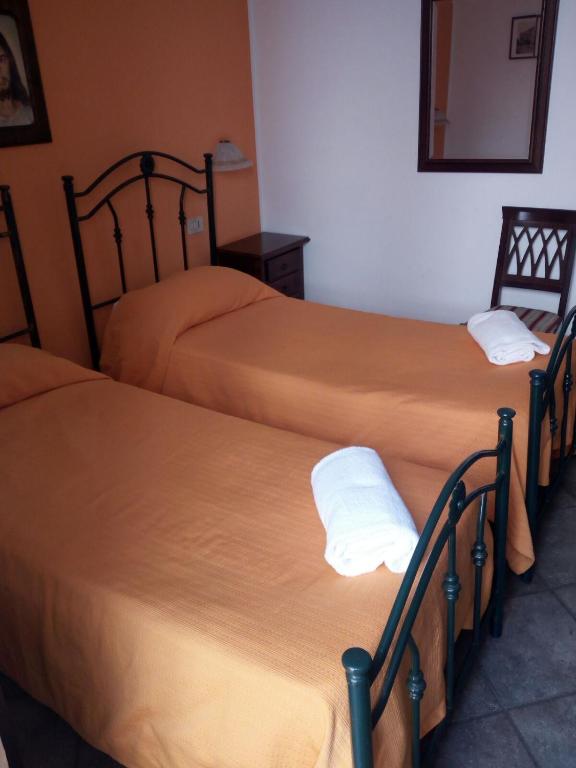 Posteľ alebo postele v izbe v ubytovaní Hotel Concordia