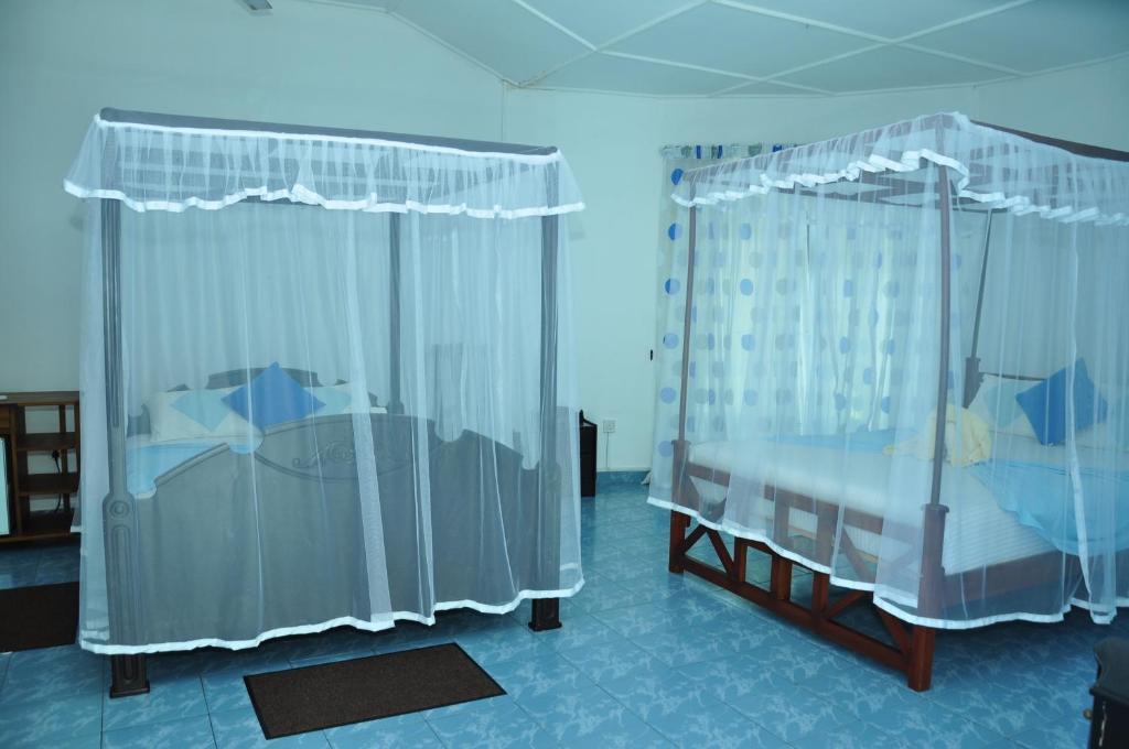 Postel nebo postele na pokoji v ubytování Latheena Resort