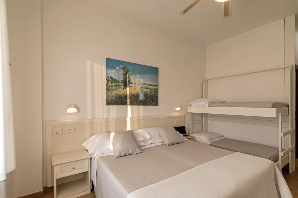 Postel nebo postele na pokoji v ubytování Trevi Family Resort