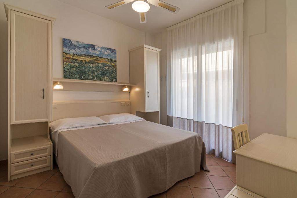 Postel nebo postele na pokoji v ubytování Trevi Family Resort