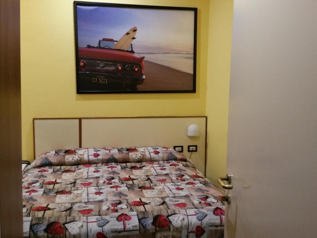 Postel nebo postele na pokoji v ubytování Hotel Il Giardino