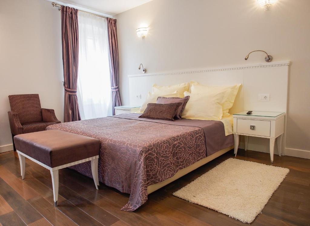 Postel nebo postele na pokoji v ubytování DeVecchi rooms