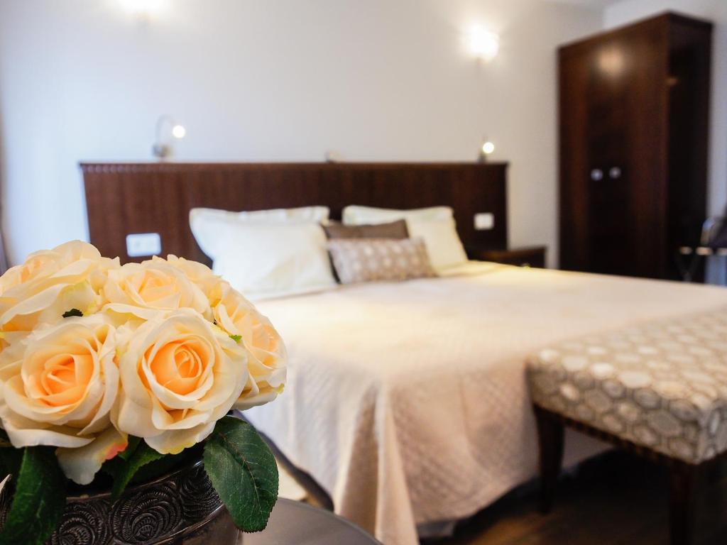 Postel nebo postele na pokoji v ubytování DeVecchi rooms