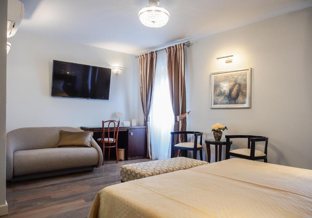 Postel nebo postele na pokoji v ubytování DeVecchi rooms