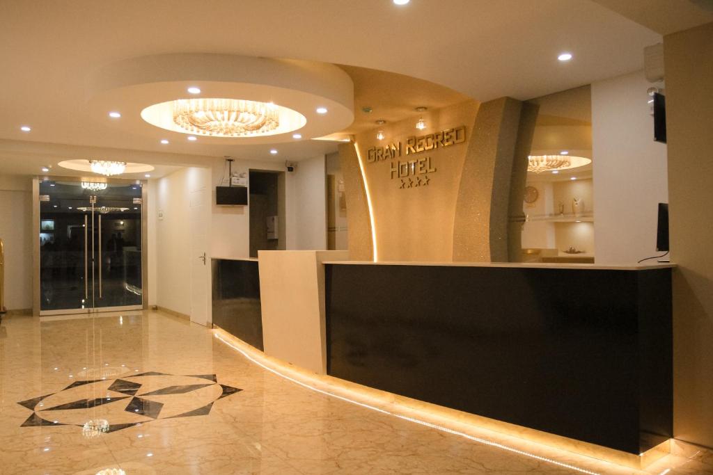 a lobby with a reception desk in a building at Gran Recreo Hotel - Trujillo - Perú in Trujillo