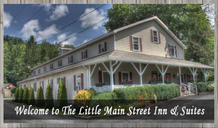 a picture of a white house with the words welcome to the little main street inn at Little Main Street Inn in Banner Elk