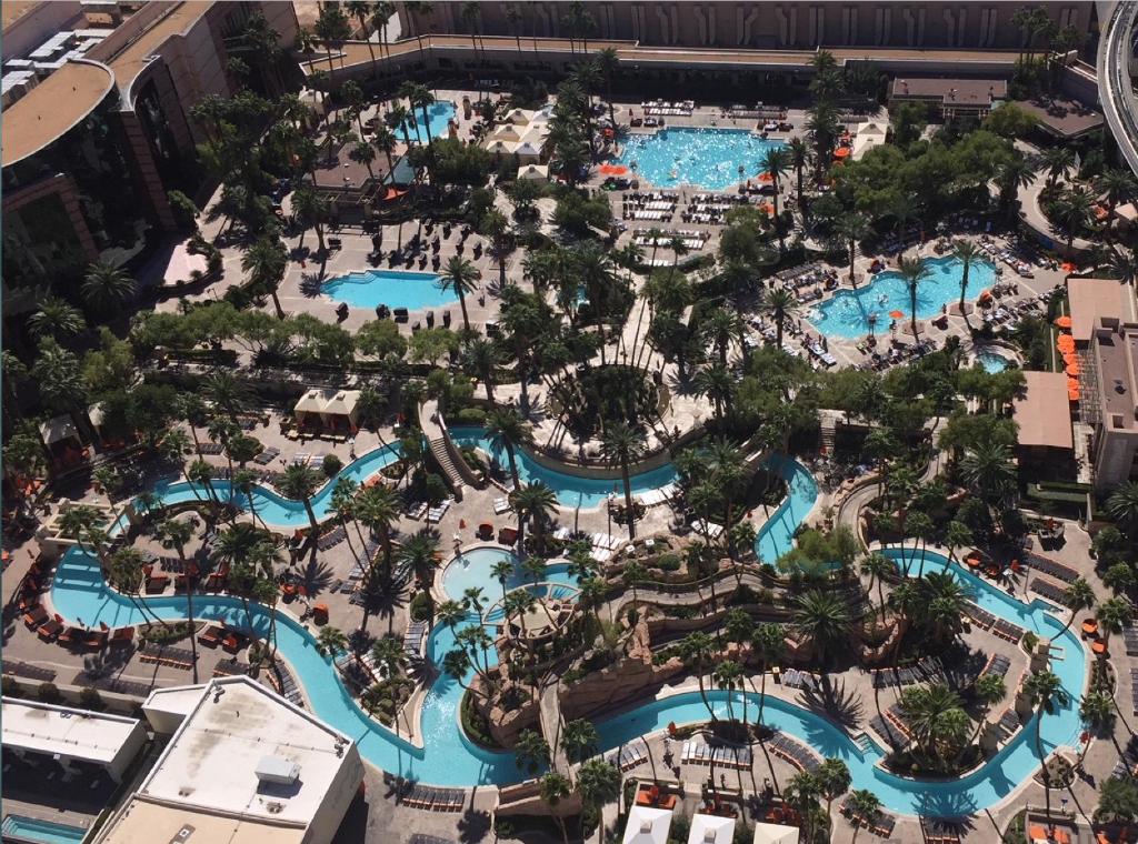 an aerial view of a resort with several pools at Signature MGM 1 Bedroom Penthouse Suite in Las Vegas