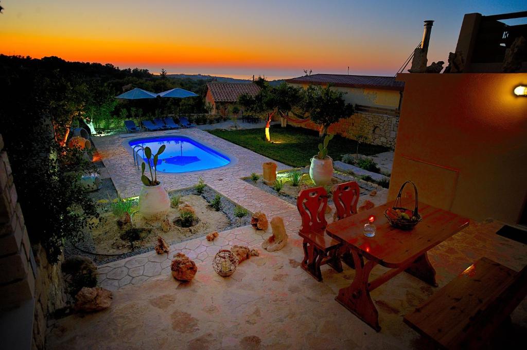 an aerial view of a backyard with a swimming pool at Pithari Villa in Agios Dimitrios