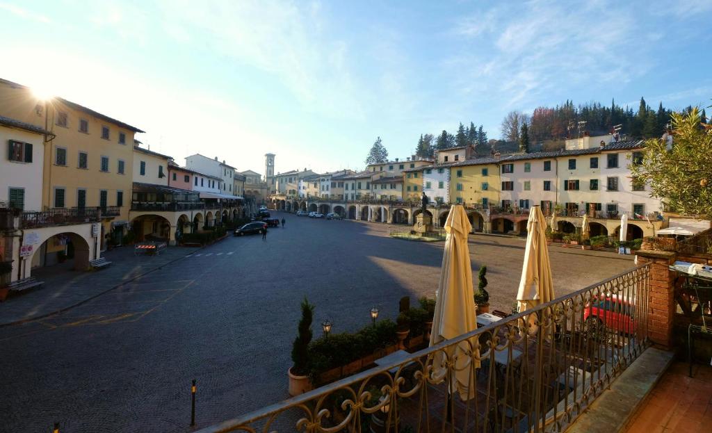 a view of a street with umbrellas on a balcony at casagreve in Greve in Chianti