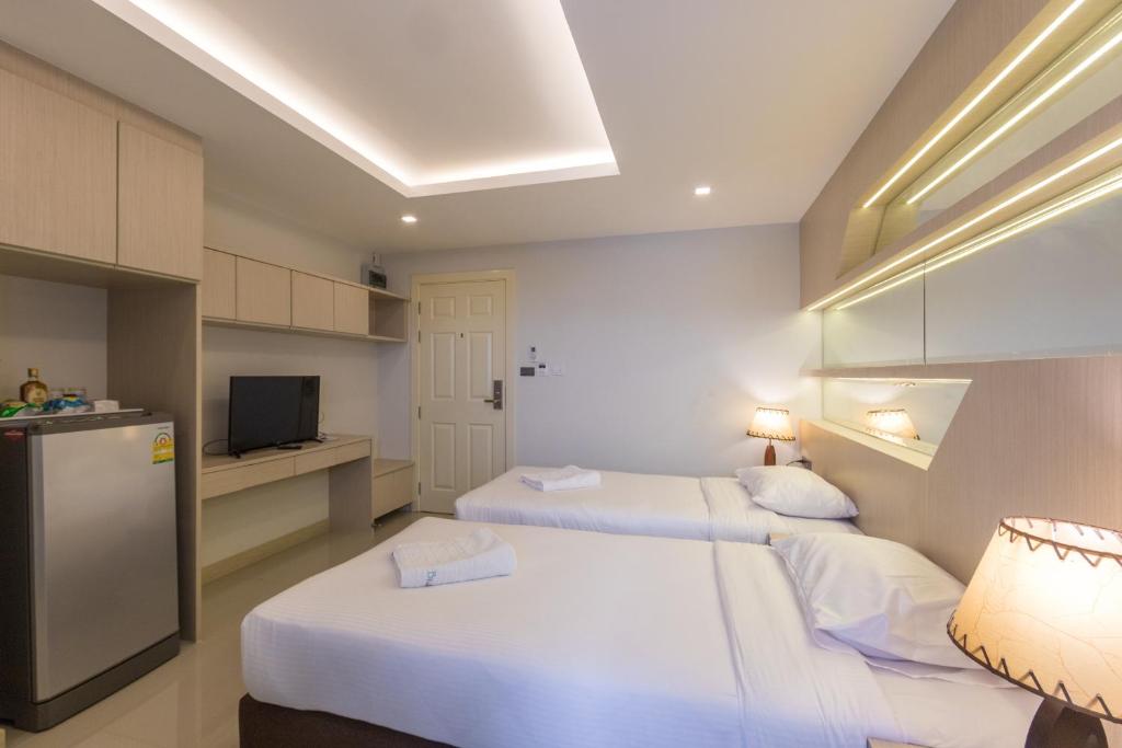 เตียงในห้องที่ B-your home Hotel Don Mueang Airport Bangkok