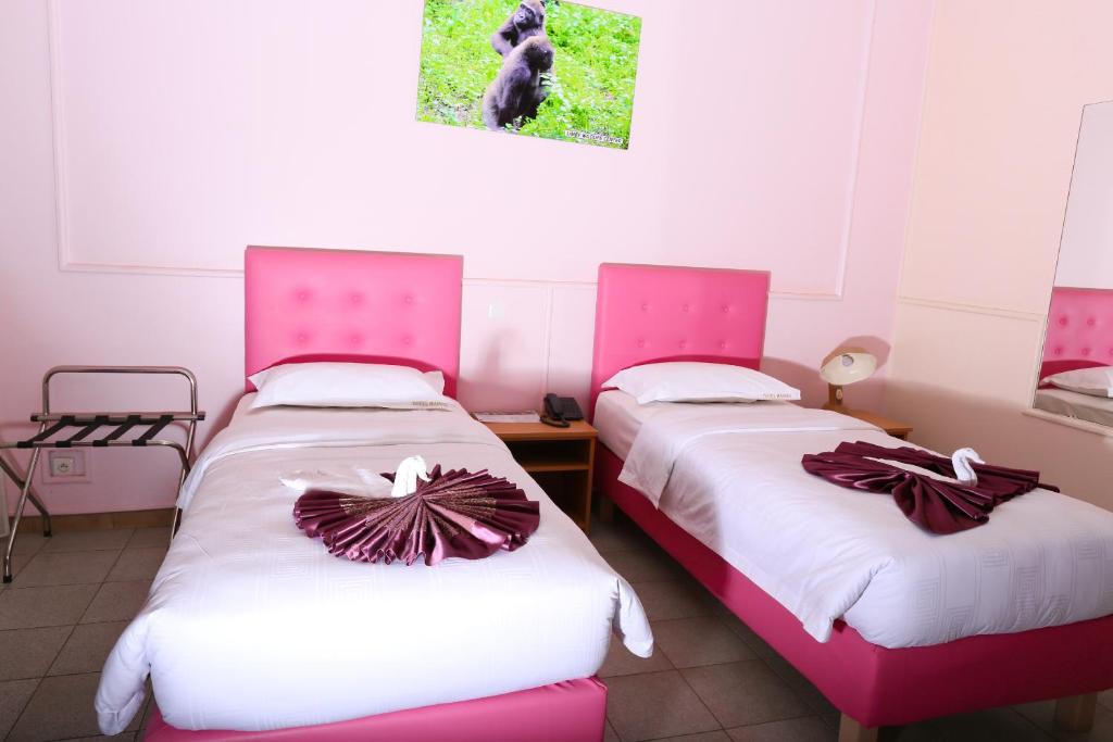 Postel nebo postele na pokoji v ubytování Hotel Mansel