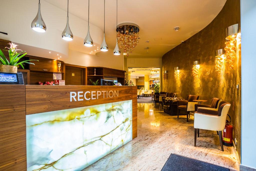 Posezení v ubytování WELLNESS HOTEL LÖWE