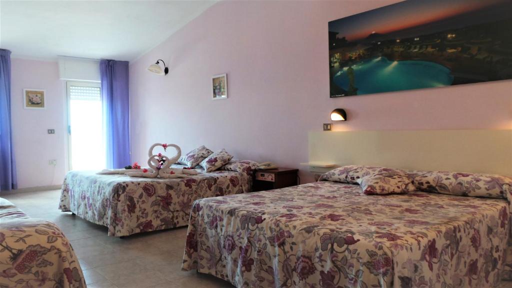 Posteľ alebo postele v izbe v ubytovaní Hotel Orizzonte Blu